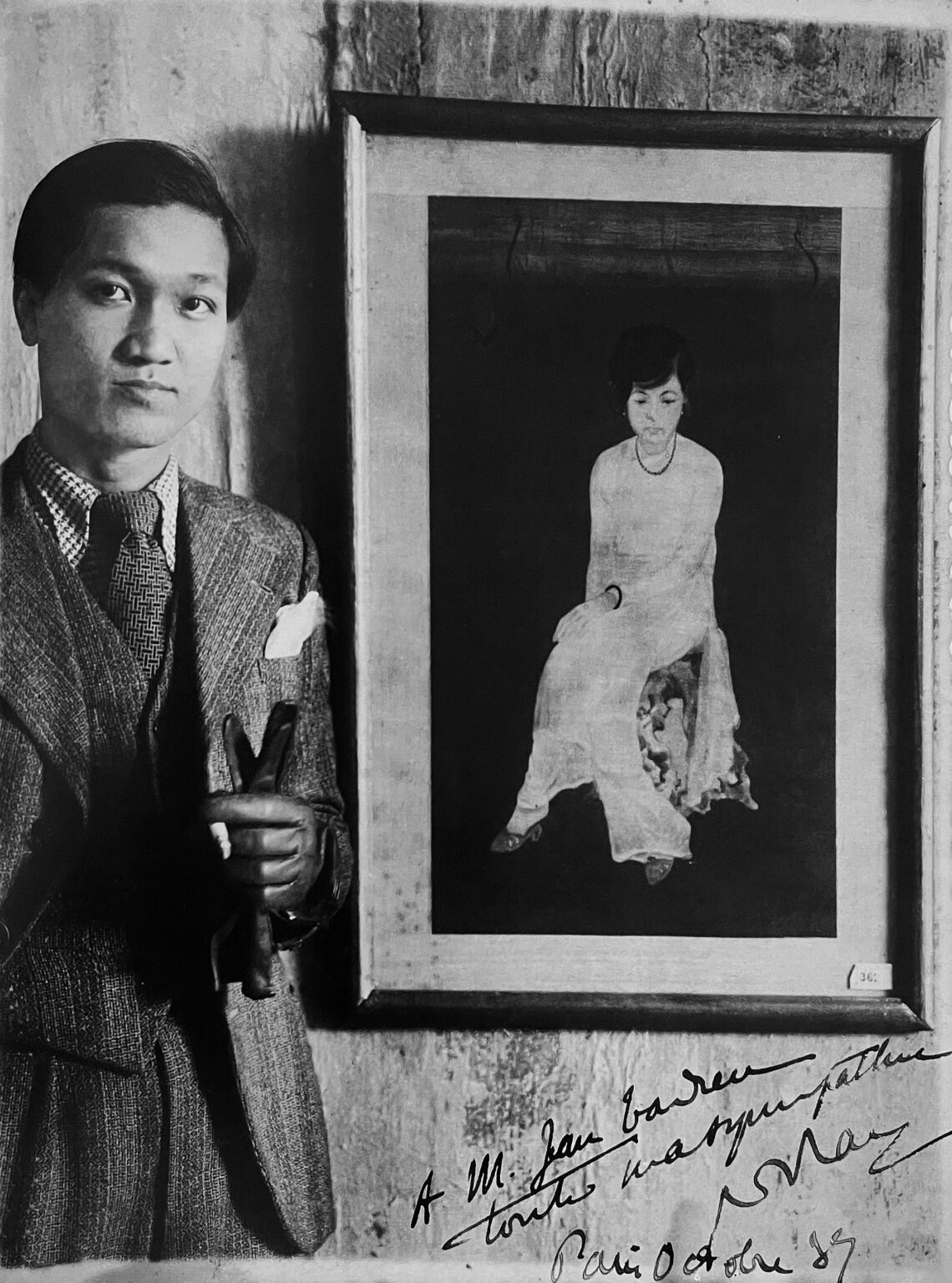 Nguyen Tuong Lan (Vietnamese, 1906-1946) in front of one of his works, today found in the Fine Arts Museum of Hanoi