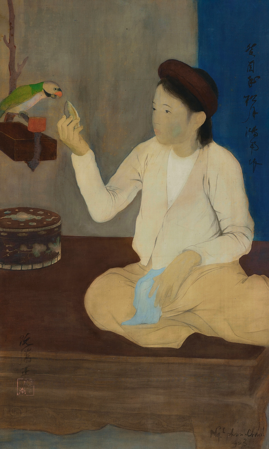 NGUYEN PHAN CHANH (VIETNAM, 1892-1984)
Jeune fille au Perroquet (Young Girl with Parrot)
inscribed in Chinese (upper right); signed and dated 'Ng phan-Chanh 1933' (lower right); signed again in Chinese (lower left)
ink and gouache on silk in the original Gadin frame
82 x 49 cm. (32 1/4 x 19 1/4 in.)
Painted in 1933
one seal of the artist

By 1933, Nguyen Phan Chanh was already known to a wide audience: through his school in Vietnam, the Hanoi School of Fine Arts, which often organized exhibitions since 1929, and internationally, from 1931 onward, when l’Illustration, a famous publication at the time, wrote an illustrated article on the Paris Colonial Exhibition. Following this major event, the AGINDO (Indochina Economic Board) in Paris was in charge of exhibiting and promoting works by the best students of the Hanoi School of Fine Arts including Phan Chanh’s. As a result, many high quality works were sent to France and acquired by prestigious French art collectors.

However, and it is a known fact, the role of a collector is essential in building the success of any artistic endeavour. One can become an artistic mentor as demonstrated by our painting presented here: Indeed, a letter dated 24 October 1933, from Blanchard de la Brosse (Director of AGINDO) addressed to Victor Tardieu (Director of Hanoi School of Fine Arts) describes the French collectors’ tendencies and taste. When the French Minister at the time, Mr. Balinier, expressed his preference for a piece by Nam Son over the Devin by Nguyen Phan Chanh, Blanchard de la Brosse wrote in regret: “This incident confirms that the French art amateur has a strong leaning towards colour. No matter how evocative of Tonkin Phan Chanh’s works can be, and despite its remarkable quality, one can only come to the conclusion that they just don’t appeal to the public. It is desirable for this excellent artist to cultivate a palette of brighter colours (…)” 

These few lines summarize the general feeling about Phan Chanh’s work and even some of the ‘new’ collectors would reproach the sombre ochre and muggy aspect of his work. One can expect that Tardieu would share these remarks with the artist which could explain the genesis of La jeune fille au perroquet. It is a truly extraordinary work where the artist moved away from his preferred classical monochrome set in a camaieu of brown for a more colourful chromatic range. On the other hand, he remained deeply faithful to his very own compositions, unusual and original, based on a clever use of geometry achieved by the application of subtle tones. The painting reveals a great sweetness, a mix of humility and dignity so characteristic to the painter’s work.

The young girl is depicted seated in the centre of the work on a large wooden bed, defined by horizontal and vertical lines complemented by a great blue rectangle in the background’s upper right corner. Nguyen Phan Chanh would very often use this triangular construction and this is well demonstrated here with the use of black ink in the headdress, the bird’s tub and also the use of dark brown in the round dark box decorated with mother-of-pearl motifs. The girl’s arms feeding the bird with sapota fruit also creates two open triangles. Three touches of colour reinforce the triangle effect: the blue panel, the tissue held in the left hand and the other triangle created by the parrot itself, the sapota fruit and the cup. Only the roundness of the decorated box with mother-of-pearl motifs breaks the angular effect, a choice often made by the artist.

For a painter used to depicting mostly rural trades and scenes of the common people, this interior scene is rare. The furnishing and the bird’s food in this interior demonstrates a high social class in this very subtle work kept in a very good condition and still in its original Gadin’s frame.

Our La jeune fille au perroquet is truly a masterpiece by Nguyen Phan Chanh.

Jean-Francois Hubert
Senior Expert, Vietnamese Art