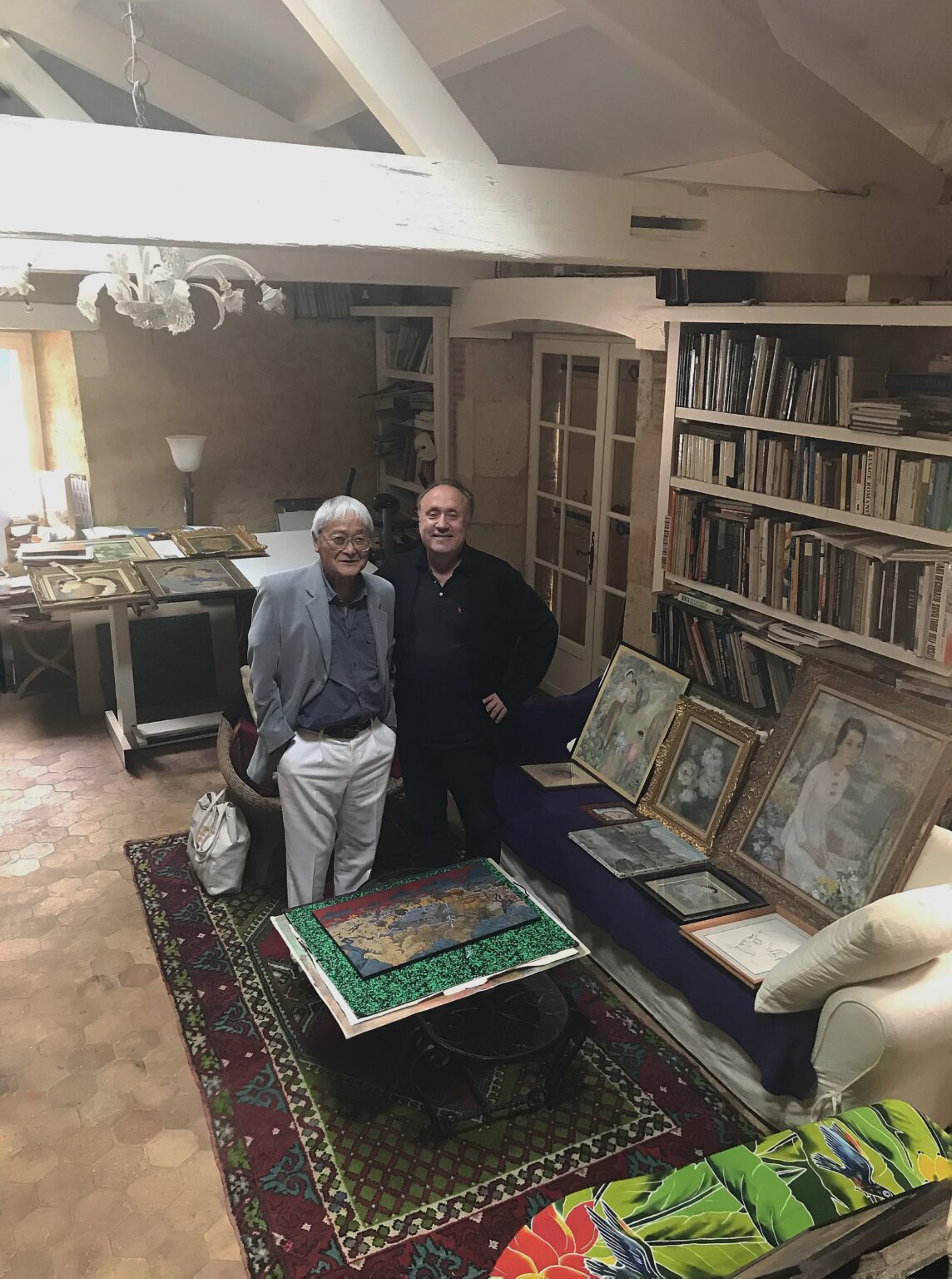 Ngo Manh Duc (B. 1941), son of Le Thi Luu (Vietnamese, 1911-1988) and Mr Jean-François Hubert, Christie’s Senior Expert, Vietnamese Art along with Le Thi Luu’s masterpieces at Ngo Manh Duc’s home. Paintings presented at Christie’s auction sale The Ngo Manh Duc Collection or The Homage of a Son to His Mother, Hong Kong, November 24, 2019.