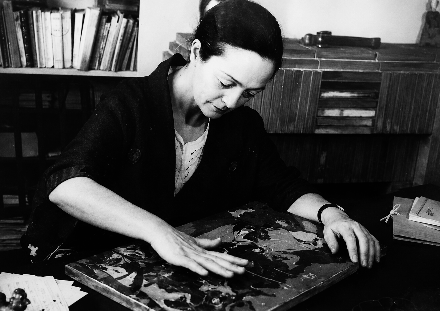 Alix Aymé polishing a lacquer panel in her Paris studio, around 1950