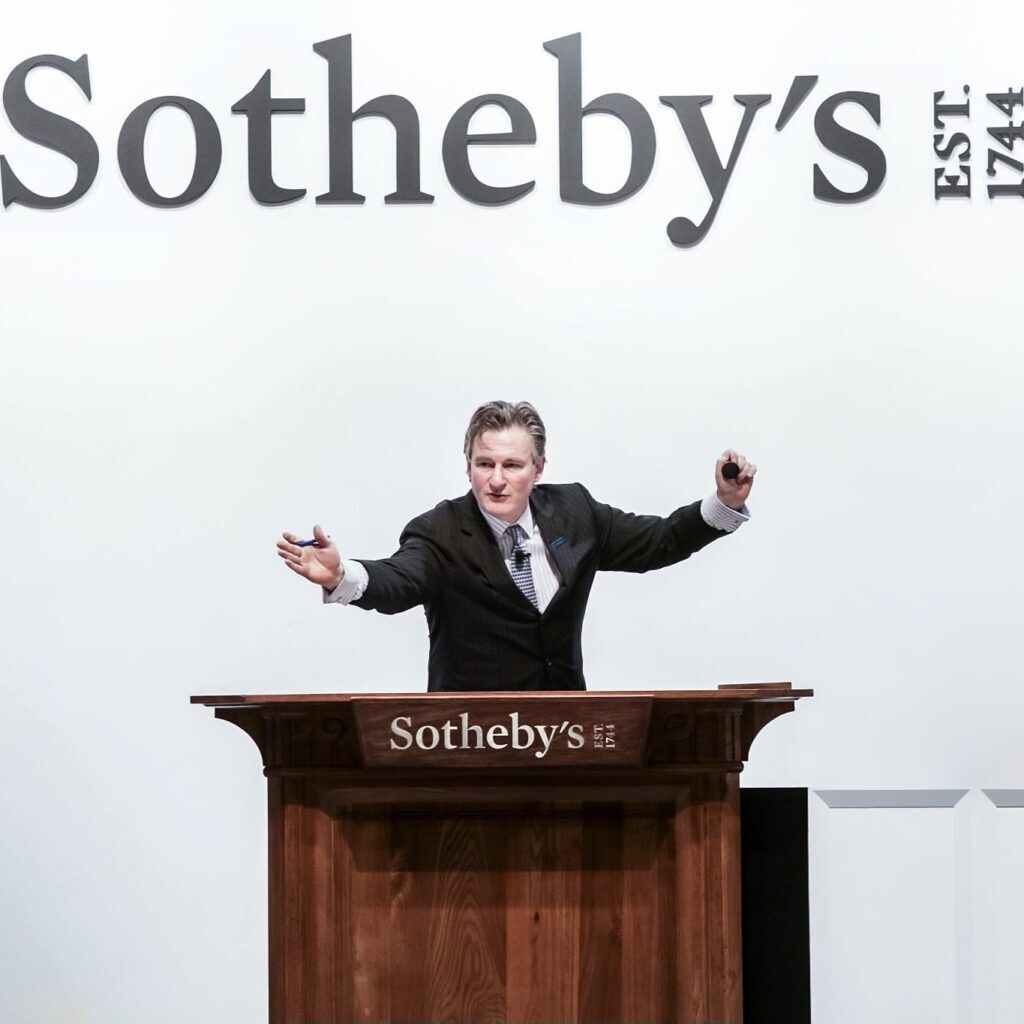 Henry Howard-Sneyd (L), Chairman of Asian Arts, Americas and Europe, heads an auction for an extremely rare Qing Dynasty bowl -- one of only three known to exist -- at Sotheby's in Hong Kong on April 3, 2018.
An extremely rare Qing Dynasty bowl made for the Chinese emperor Kangxi fetched 30.4 million USD, Sotheby's said. / AFP PHOTO / ISAAC LAWRENCE        (Photo credit should read ISAAC LAWRENCE/AFP via Getty Images)