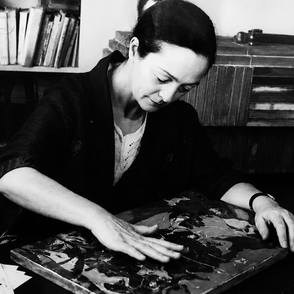 Alix Aymé polishing a lacquer panel in her Paris studio, around 1950
